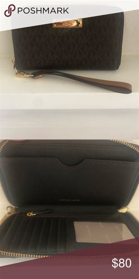 Amazon.com: Michael Kors Logo Continental Wristlet.